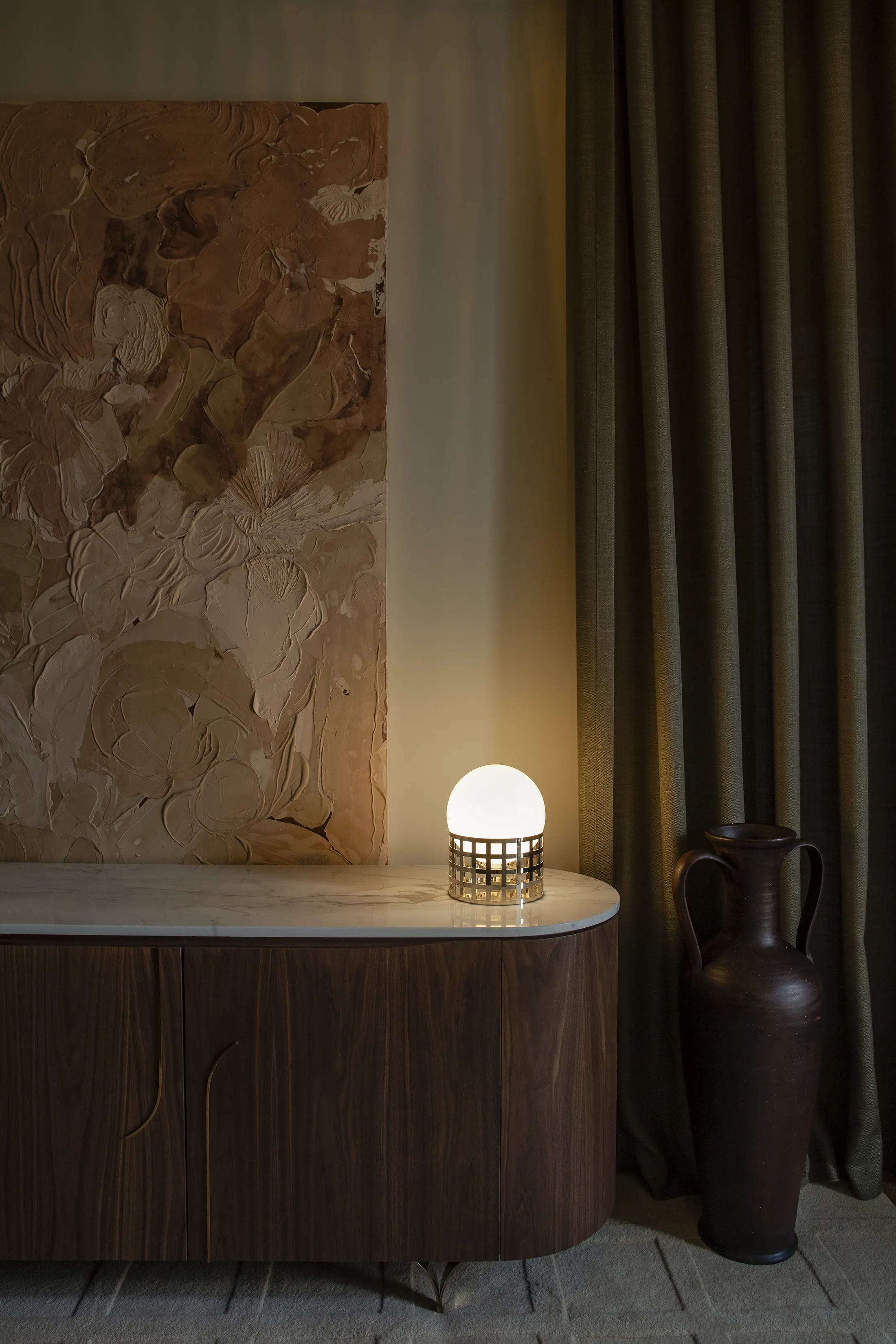 Full Moon Ride Table Lamp - Inspired by the iconic chrome finishes of the Mid Century era. Features a meticulously crafted grid pattern accentuating its geometric harmony. Conceptually alluring and transcending boundaries of conventional lighting.